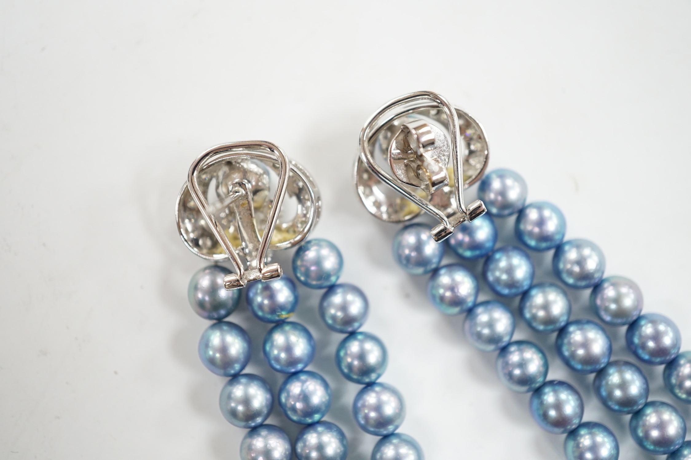 A modern pair of white metal, diamond chip cluster and bluey/grey three row cultured pearl tassel drop earrings, 89mm.